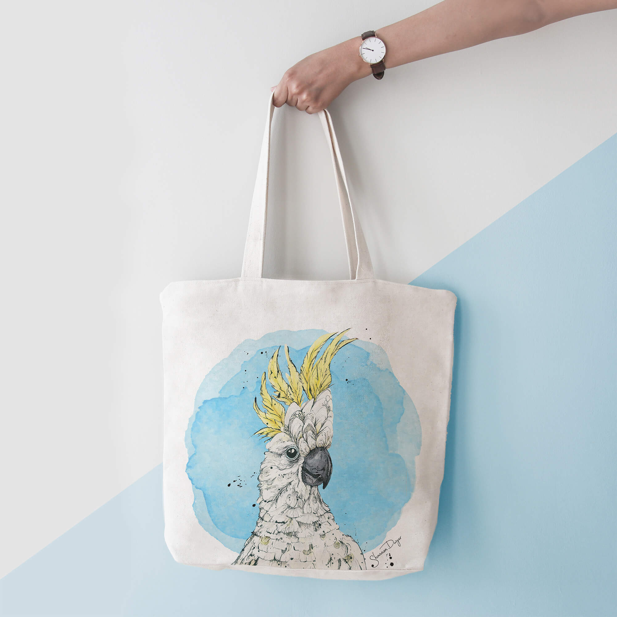 A parrot is printed on a tote bag.